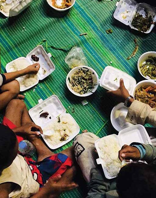 Support Urgent Needs - street children in Thailand being fed warm food